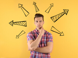 Choice in profession or other areas of life, concept. Making decision, thoughtful young man...