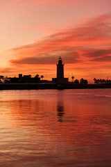 Fototapeta na wymiar Lighthouse in Malaga at sunrise.