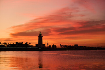 Lighthouse in Malaga at sunrise.