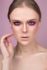 portrait of a woman with bright pink make-up and frills