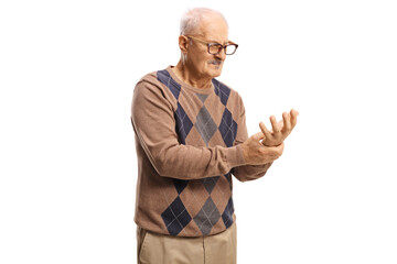 Mature man holding his painful wrist