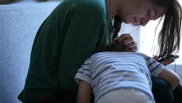 Mother consoling hurt child. Parent embracing little boy. Love family lifestyle caressing toddler kid