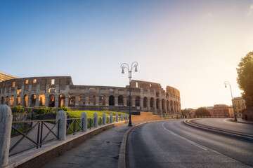 Amazing panoramic view of the Colosseum at beautiful warm light after sunrise, Rome, Italy.