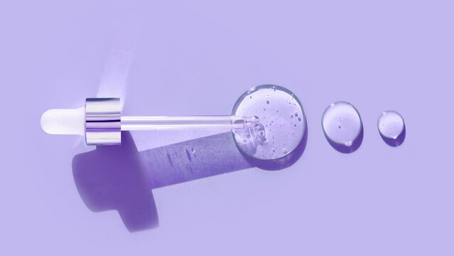 pipette drop of serum test on a purpule background