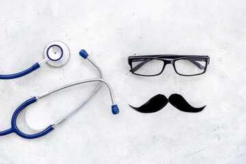 Black glasses with a mustache and stethoscope. Mans health concept