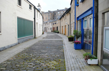 Deserted Cobblestone Lane with Mews Houses