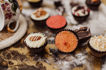 Small chocolate candies on colorful tray