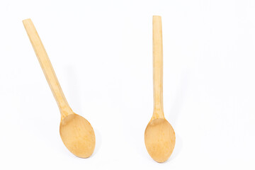 wooden spoon at different angles on a white background