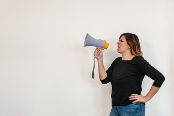 angry woman shouting through a loudspeaker
