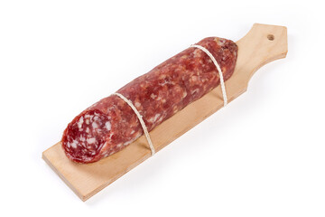 Salami piece on special wooden cutting board on white background