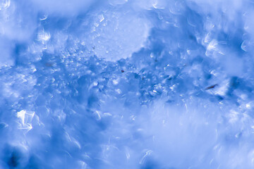 abstract and magic background of snowflakes of blue color with copy space