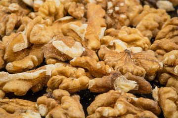 Pile of peeled walnut kernels close up
