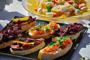 Various bruschettas at a catering service, outdoor