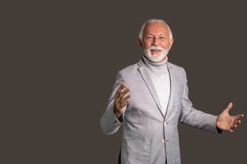 Senior businessman looking happy with open arms