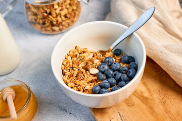Fresh fragrant homemade granola made from oatmeal, honey and nuts. Balanced breakfast or snack