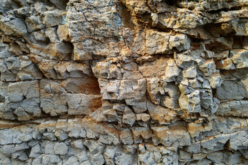 Close-up of the rocky texture of the rock, background.