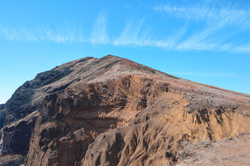 Beautiful dark red mountains, volcanic rocks on the island of Madeira.