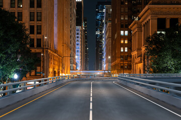 Obraz premium Empty urban asphalt road exterior with city buildings background. New modern highway concrete construction. Concept of way to success. Transportation logistic industry fast delivery. Chicago. USA.