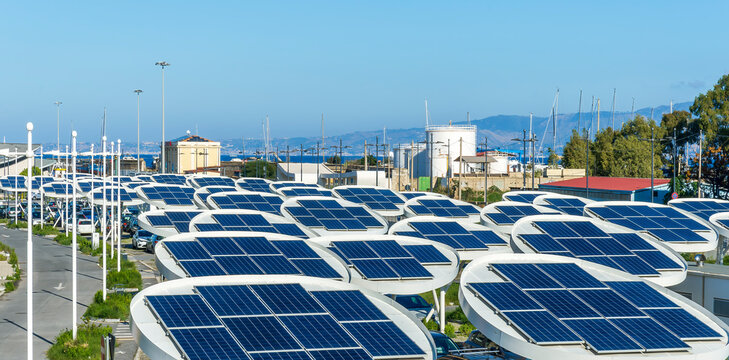 solar power plant with big antennas on a parking for charging electrocars, car energy of future