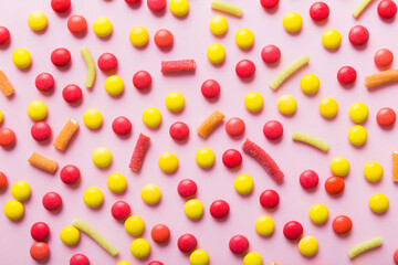 colorful candies as background top view. Seamless pattern with candy. Many sweet candies close-up