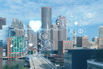 Panorama city view of Boston Harbor at day time, Massachusetts. Buildings of financial downtown. Glowing healthcare digital medicine icons. The concept of treatment from disease, Threat of pandemic