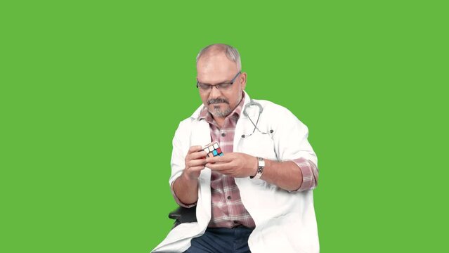 Indian Doctor Thinking any playing Rubik"s cube