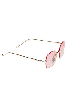 Close-up shot of fashion rimless glasses with pink lenses and with thin temples. Rectangular glasses without frames are isolated on a white background. Side view.