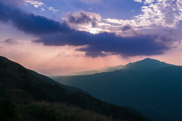Fototapeta na wymiar Watch the romantic Crepuscular Ray (cloud gap light) on the mountain. Buyan Pavilion, Shuangxi District, New Taipei City. Taiwan