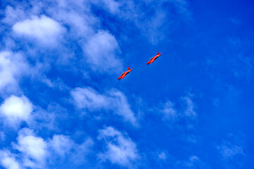 Tow red PC-21 airplanes of the Swiss Air Force up in the sky at City of Zürich, register A-102 and A-108. Photo taken November 21st, 2022, Zurich, Switzerland.