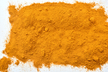 Natural Dried Turmeric (Curcuma) powder background. Macro Close up of Turmeric. Turmeric Powder (Curcuma longa). Curcuma dust texture.