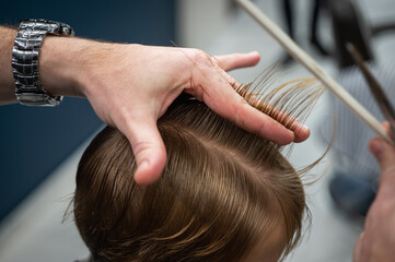 Fototapeta premium close up haircut, scissors and comb. Selective focus