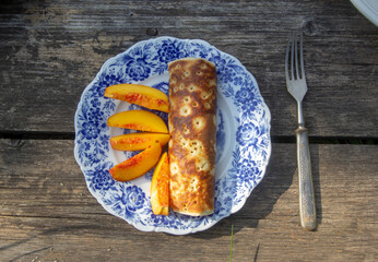 peaches and pancakes in a vintage plate
