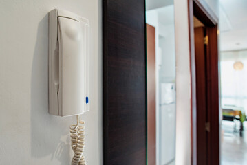 Intercom in the apartment on a white wall close-up