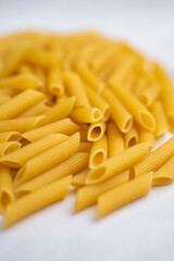 dry pasta, ingredient for cooking, light background, space for text