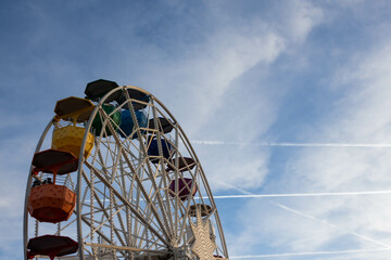 Ferris wheel and blue sky.