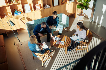 Diverse businesspeople having a meeting in an office lounge
