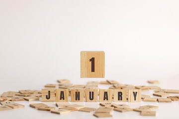 January 1 displayed on wooden letter blocks on white background