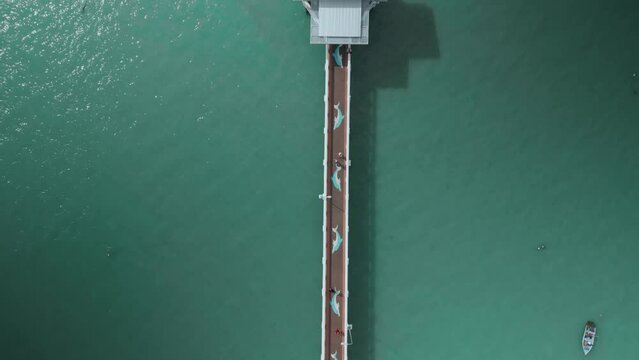 aerial view of pier,top view,people walking along pier