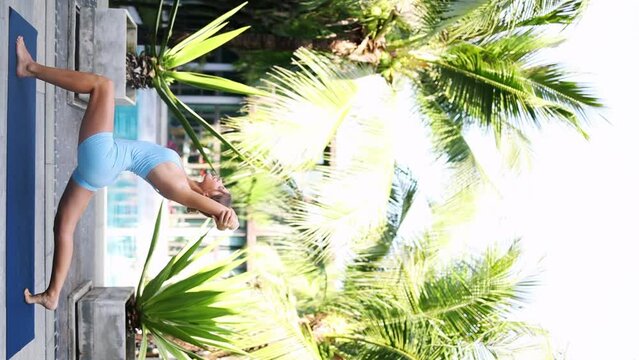 yoga in tropical asia,woman does yoga and stretching