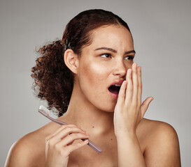 Toothbrush, woman and bad breath with dental problem while smelling odor of mouth, teeth or gums in...
