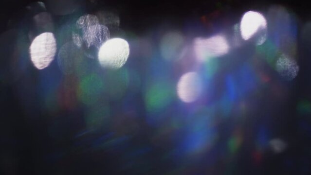 Defocused abstract lens flare background. Blurry bokeh lights flicker