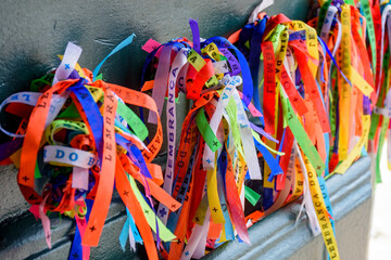 Door with famous and colorful ribbons of our lord do Bonfim which is believed to bring luck and are traditional in the city of Salvador in Bahia.