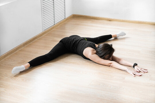 Slim woman doing yoga exercises