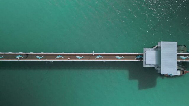 aerial view of pier,top view,people walking along pier