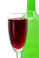glass of red wine with bottle isolated on white background