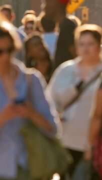 Crowd, couple standing on a sidewalk, summer day in Manhattan, vertical video