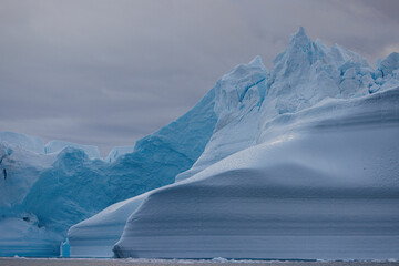lines in big icebergs floating over sea