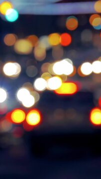New York City traffic, nighttime, colorful light, blurred, vertical video