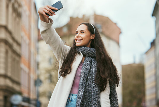 Travel, phone or woman takes a selfie for social media in city of Paris walking on a relaxing holiday vacation or weekend. Smile, pride or happy girl tourist taking fun pictures alone to post online