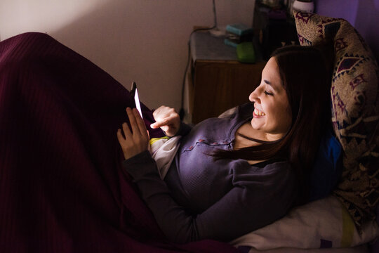 Woman laughing at memes